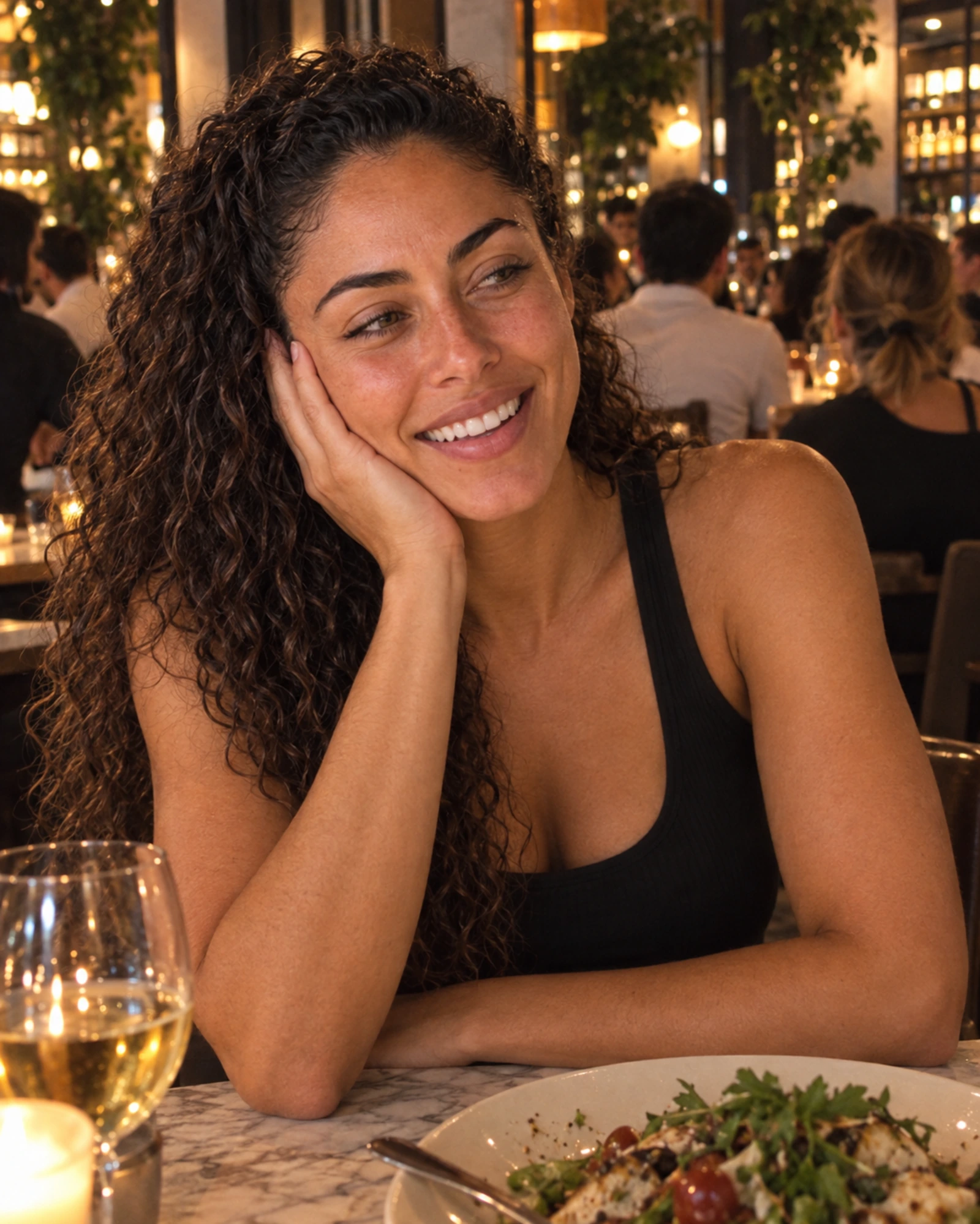 Camila laughing at a restaurant in a friend-shot photo